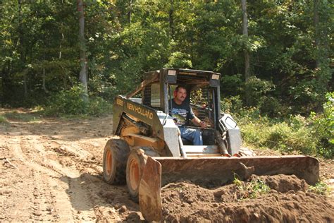 pond building with skid steer|skid steer loader.